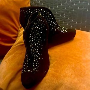 A pair of suede 3. Inch ankle heels boots some wear inside